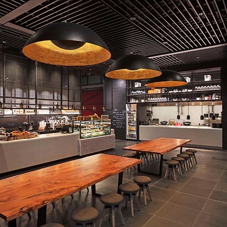 Park Hyatt Auckland Hotel Exterior foto The interior of a Starbucks Reserve store in Shanghai, China